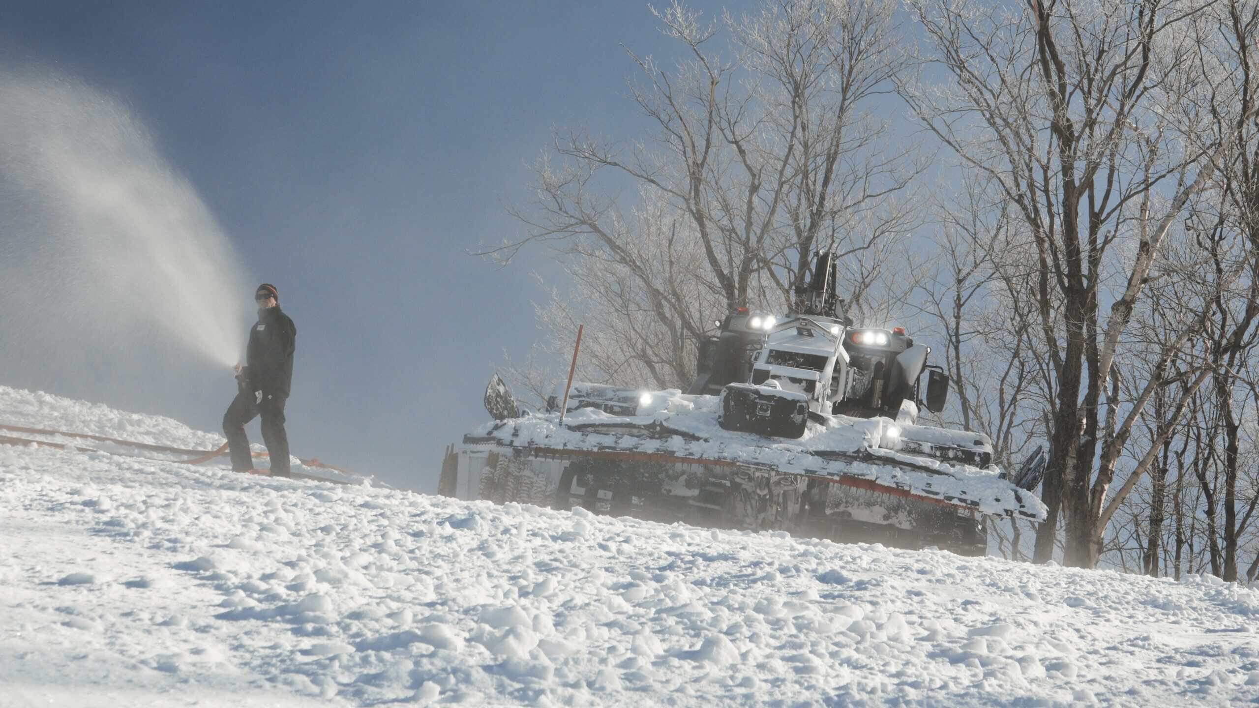 Snowbound Coupe du Monde Tremblant event with a water spray and snow-covered tank.